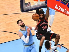 Toronto Raptors forward DeAndre' Bembry dunks against Memphis Grizzlies center Jonas Valanciunas during the second half at FedExForum.