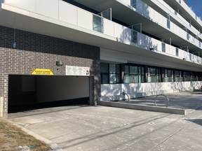 The entrance to the underground parking garage of an apartment building at 2301 Danforth Ave., just east of Woodbine Ave., is seen on Wednesday, Feb. 10, 2021, the day after a man was shot to death.