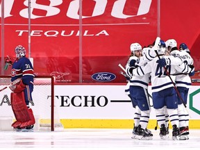 Toronto Maple Leafs centre Auston Matthews (34) celebrates his goal against Montreal Canadiens goaltender Carey Price (31) with teammates during the second period at Bell Centre.
