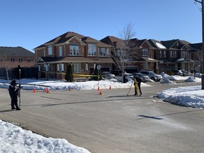 Evidence markers are seen after a shooting in Brampton early Thursday morning that left a 22-year-old man in life-threatening condition.
