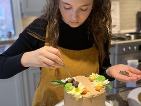 Julia Gallay from gallzprovisions creates one of her cakes.