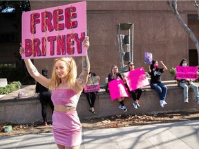 Alandria Brown, a supporter of singer Britney Spears, gathers with other supporters outside a courthouse as a judge hears the singer’s temporary conservatorship in Los Angeles, Feb. 11, 2021.