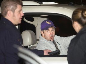 Jamie Spears, the father of pop singer Britney Spears, talks with two police officers at the entrance of the Cedars Sinai Hospital in Beverly Hills, California, January 4, 2008.