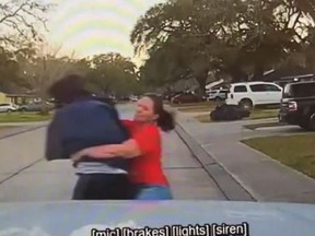 A mom in Texas is caught by police dash cam tackling a man allegedly peering into her 15-year-old daughter's bedroom.