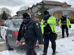 Toronto Police at the scene on Westona St. after two officers were attacked by a man with a knife Tuesday, Feb. 2, 2021.