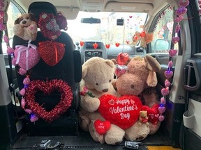 Now that Valentine's Day is this weekend, Forest Atkinson has decorated her Dodge Grand Caravan she drives for Uber with hearts, flowers and teddy bears to boost spirits of her passengers.