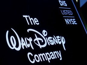 A screen shows the logo and a ticker symbol for The Walt Disney Company on the floor of the New York Stock Exchange (NYSE) in New York, U.S., December 14, 2017.