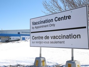 A sign erected at the entrance to Carmichael Arena advising community members that the location is a COVID vaccination centre in Sudbury
