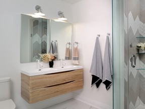 Natural wood cabinetry, as featured in this bathroom by Michelle Berwick Design, is making a comeback this year. SUPPLIED