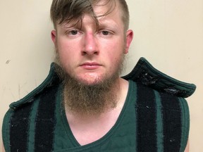 In this handout provided by the Crisp County Sheriff’s Office, Robert Aaron Long is pictured in a jail booking photo on March 16, 2021 in Cordele, Georgia.