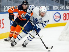 Edmonton Oilers’ James Neal chases Toronto Maple Leafs’ Morgan Reilly during Wednesday's game.