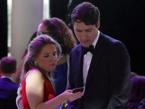 Prime Minister Justin Trudeau confers with his chief of staff Katie Telford at the National Press Gallery Dinner in Gatineau, Quebec, June 3, 2017.
