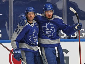 Toronto Maple Leafs' Auston Matthews (right) celebrates a goal against the Jets on Tuesday.