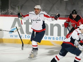 Alex Ovechkin of the Washington Capitals complains to the ref as his stick is broken by a slash during the third period against the New Jersey Devils at the Prudential Center on February 28, 2021 in Newark, New Jersey.