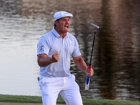 Bryson DeChambeau celebrates making his putt on the 18th green to win during the final round of the Arnold Palmer Invitational Presented by MasterCard at the Bay Hill Club and Lodge in Orlando, Florida.