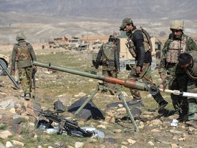 Security forces fire on Taliban positions during an ongoing operation against Taliban militants in the Sherzad District of Nangarhar Province on Feb. 9, 2021