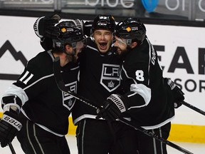 Kings' Dustin Brown celebrates a goal with Anze Kopitar (11) and defenceman Drew Doughty. Brown and Doughty have revived their fantasy value this season.