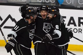 Kings' Dustin Brown celebrates a goal with Anze Kopitar (11) and defenceman Drew Doughty. Brown and Doughty have revived their fantasy value this season.
