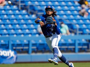 Blue Jays Austin Martin (80) throws to first base against the Pittsburgh Pirates in the top of the second during spring training at TD Ballpark.