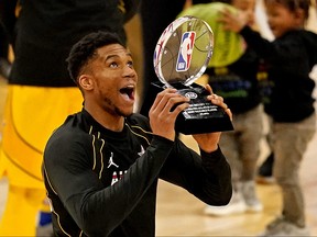 Team LeBron forward Giannis Antetokounmpo of the Milwaukee Bucks (34)  reacts to being named the MVP of the 2021 NBA All-Star Game at State Farm Arena.