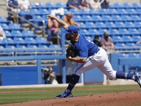 Blue Jays starting pitcher Tanner Roark deploys his new delivery during the first inning against the Detroit Tigers during spring training at TD Ballpark.