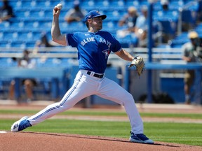 Toronto Blue Jays starting pitcher Ross Stripling (48) pitches in the first inning against the Detroit Tigers during spring training at TD Ballpark on Sunday.