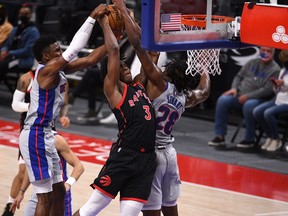 Raptors forward OG Anunoby (3) is fouled by Detroit Pistons centre Isaiah Stewart (28) during the fourth quarter at Little Caesars Arena on Tuesday.