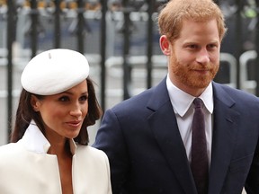 In this file photo taken on March 12, 2018 Britain's Prince Harry and his fiancee US actress Meghan Markle attend a Commonwealth Day Service at Westminster Abbey in central London, on March 12, 2018.