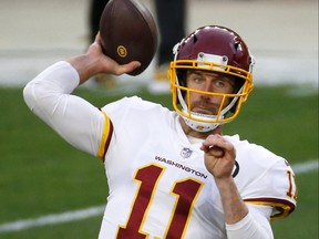 Alex Smith of the Washington Football Team warms up prior to their game against the Pittsburgh Steelers at Heinz Field on Dec. 7, 2020 in Pittsburgh, Pa.