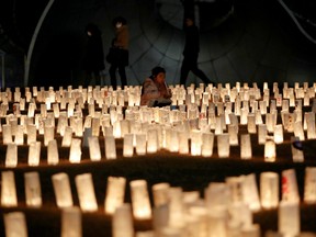 Paper lanterns are lit for the victims of the March 11, 2011 earthquake and tsunami disaster that killed thousands and triggered the worst nuclear accident since Chernobyl, in Tokyo, Japan, March 11, 2021, to mark the10th anniversary of the disaster.