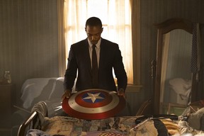 Anthony Mackie with Captain America’s shield in a scene from The Falcon and the Winter Soldier.