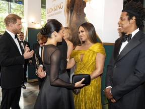 Prince Harry, Duke of Sussex, left, and Meghan, Duchess of Sussex (second from left) meets cast and crew, including Beyonce Knowles-Carter (centre) Jay-Z  as they attend the European premiere of Disney's "The Lion King" at Odeon Luxe Leicester Square on July 14, 2019 in London.