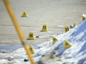 Peel Regional Police investigate an early morning shooting scene, gunfight, between a group of people that has left a man in critical condition in Brampton on Delphinium Way near Mayfield Rd and Van Kirk Dr. At least 12 bullet holes can be seen in cars and two homes where it occurred  on Thursday February 25, 2021.