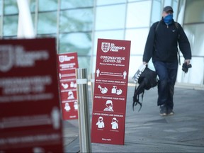 Coronavirus (COVID-19) signage outside St. George's Park before the a women's Super League soccer match in Burton Upon Trent, Britain, Feb. 28, 2021.