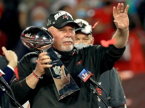 Bruce Arians of the Tampa Bay Buccaneers lifts the Lombardi Trophy after defeating the Kansas City Chiefs in Super Bowl LV at Raymond James Stadium on February 7, 2021 in Tampa, Florida