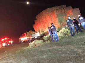 A man was rescued from being trapped beneath 1,500 pounds of hay.