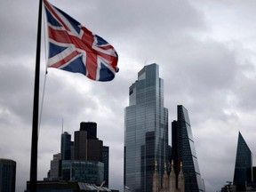 A Union Flag flutters in the wind near office buildings in London, England, Nov. 25, 2020.