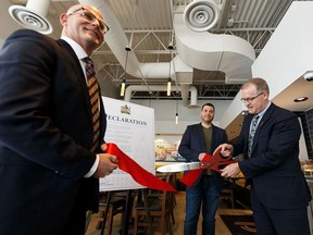 Rob Plante, left, with the Canadian Federation of Independent Business and Pasta Pantry owner Nathan Satanove, centre, were on hand as associate minister of red tape reduction, Grant Hunter declared Jan. 20-24 Red Tape Reduction Awareness Week in Alberta at Pasta Pantry in Edmonton, on Monday, Jan. 20, 2020