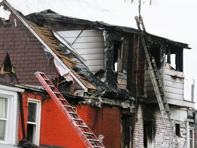 Investigations continue at a row house on Wednesday March 24, 2021. The cause of the fire is suspicious and possibly arson, police said.