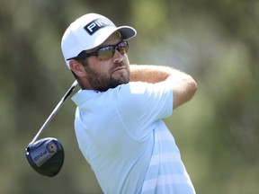 Corey Conners plays his shot from the ninth tee during the first round of The Players Championship on The Players Stadium Course at TPC Sawgrass in Ponte Vedra Beach, Fla., Thursday, March 11, 2021.