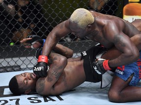 In this handout image provided by UFC,  Derek Brunson, right, punches Kevin Holland in their middleweight fight during the UFC Fight Night event at UFC APEX on March 20, 2021 in Las Vegas, Nevada.