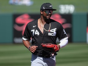 Eloy Jimenez of the Chicago White Sox walks to the dugout during a spring training game against the Kansas City Royals at Surprise Stadium on March 3, 2021 in Surprise, Arizona.