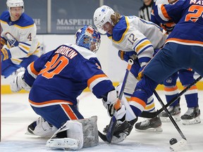 Buffalo Sabres centre Eric Staal (12) attempts to shoot against New York Islanders goalie Ilya Sorokin (30) at Nassau Veterans Memorial Coliseum.