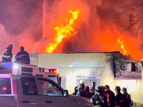 Firefighters work at a site of a fire that broke out at Evergreen Nursing Home in Spring Valley, New York March 23, 2021 in this still image obtained from a social media video.