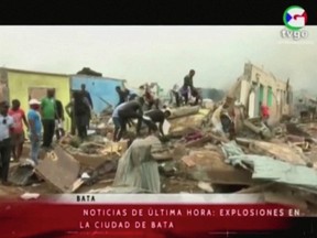 People search through rubble following explosions at a military base, according to local media, in Bata, Equatorial Guinea March 7, 2021.