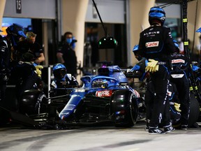 Fernando Alonso of Spain driving the Alpine A521 Renault stops in the Pitlane during the F1 Grand Prix of Bahrain at Bahrain International Circuit on March 28, 2021 in Bahrain, Bahrain.