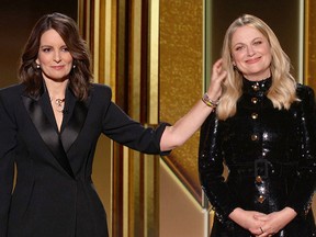 Hosts Tina Fey (left) and Amy Poehler are seen in this handout screen grab from the 78th Annual Golden Globe Awards in Beverly Hills February 28, 2021.