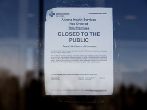An Alberta Health Services closure order is visible posted on the front door of GraceLife Church, in Spruce Grove Friday March 5, 2021.