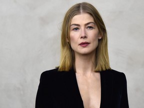 Rosamund Pike attends the Giorgio Armani women's Fall/Winter 2019/2020 collection fashion show, on Feb. 23, 2019 in Milan.