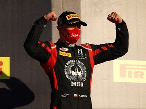 Race winner Nikita Mazepin of Russia and Hitech Grand Prix celebrates on the podium during the Formula 2 Championship Feature Race at Mugello Circuit on September 12, 2020 in Scarperia, Italy.